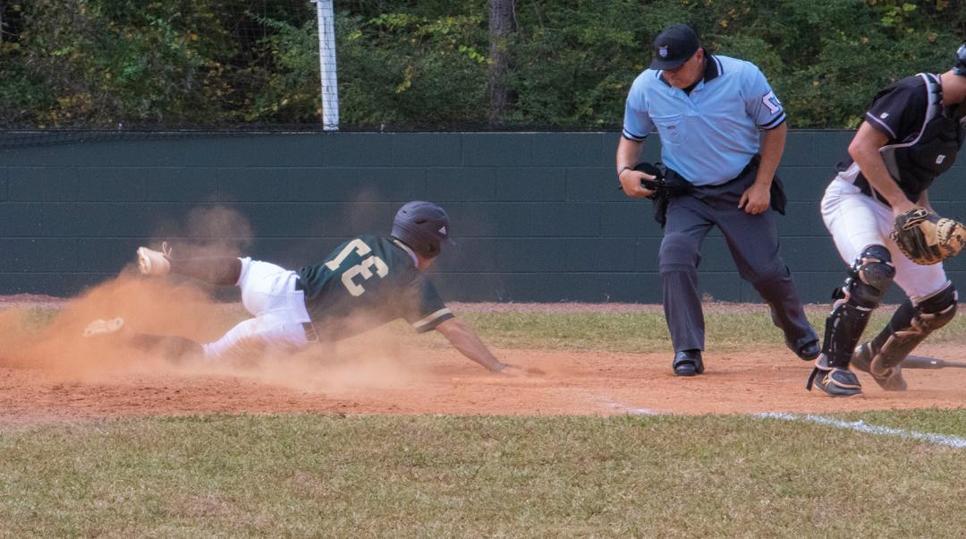 Bobcat baseball player slides into home